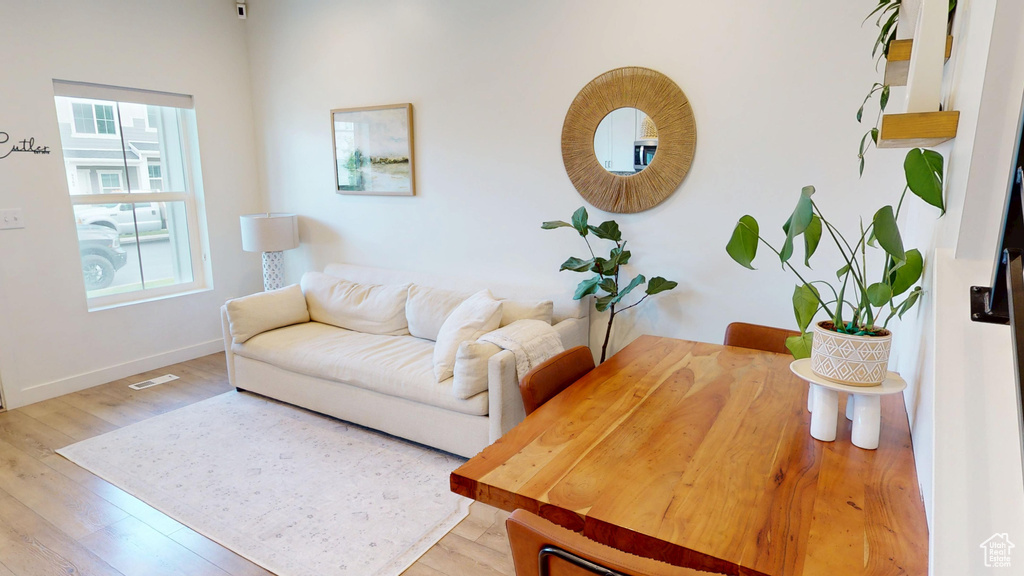 Living area featuring light wood finished floors and baseboards