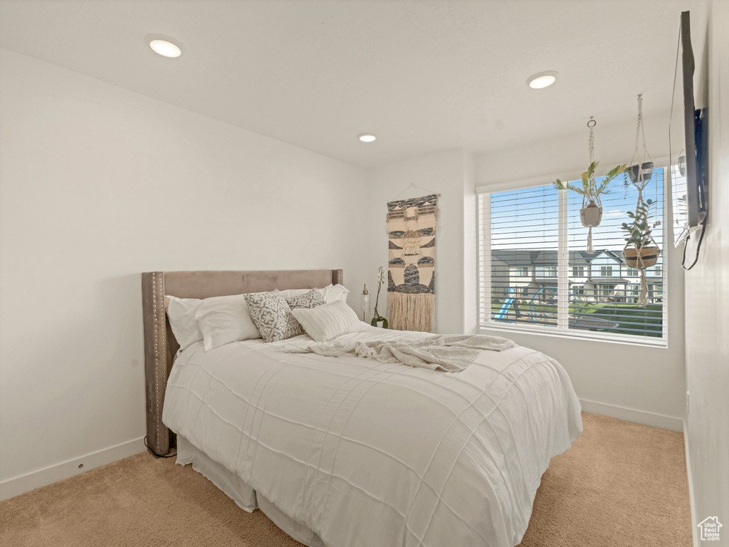 Bedroom with carpet, baseboards, and recessed lighting