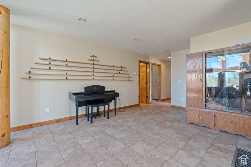 Living room featuring baseboards and recessed lighting