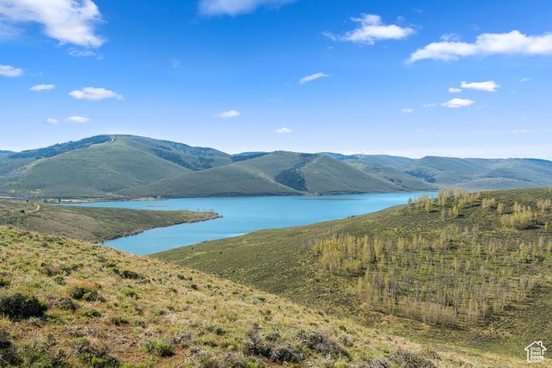 Mountain view featuring a nearby body of water
