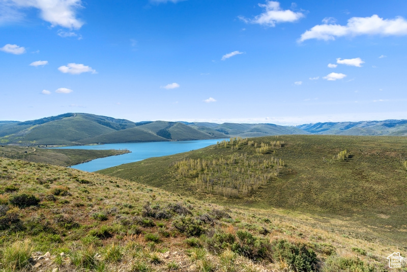 View of mountain backdrop with a large body of water