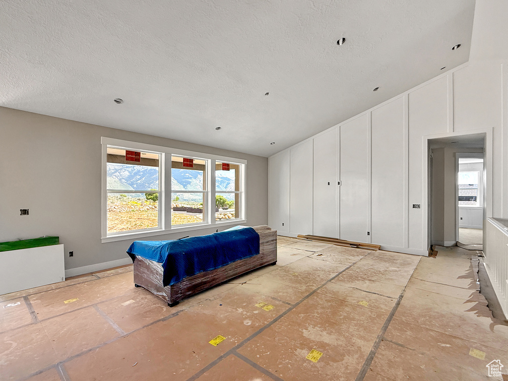 Bedroom with a textured ceiling