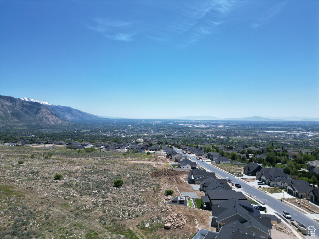 Aerial view of residential area featuring mountains