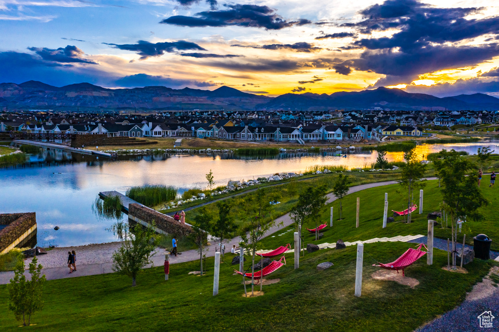 Aerial view at dusk of a water and mountain view and a residential view