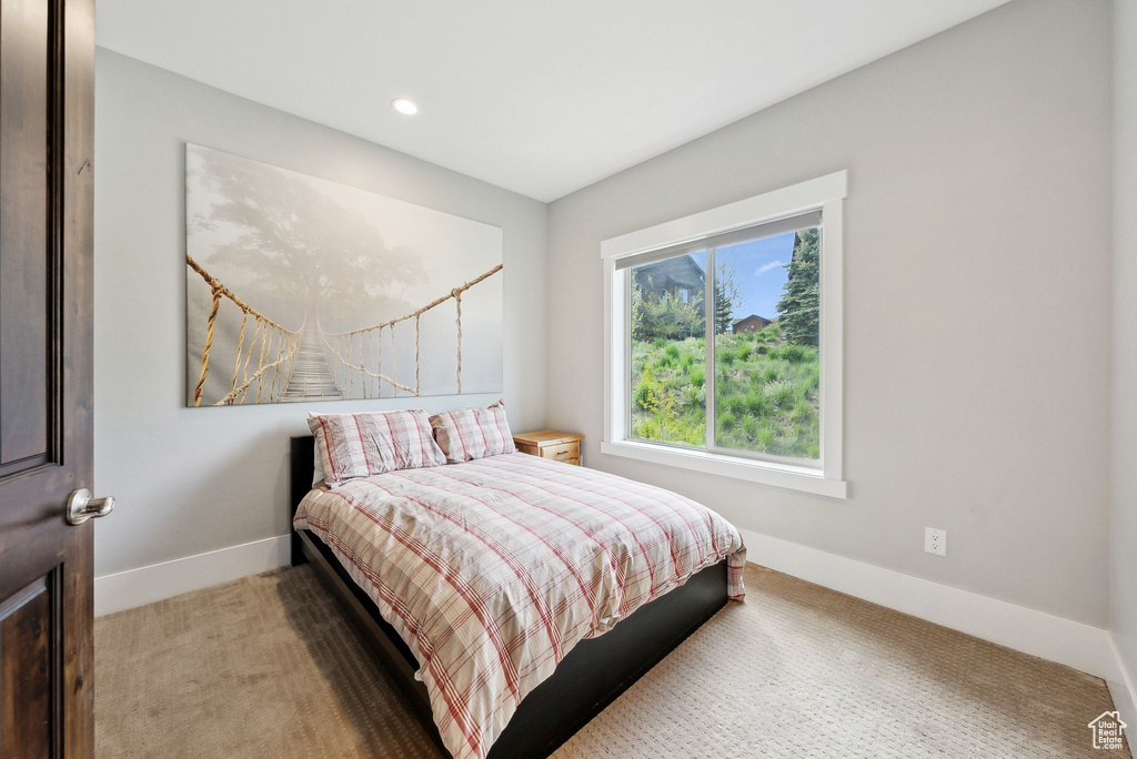 Bedroom featuring carpet flooring, baseboards, and recessed lighting