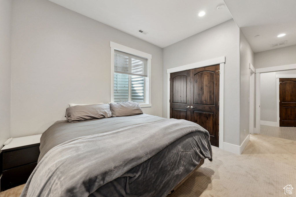 Bedroom featuring carpet flooring, recessed lighting, baseboards, and a closet