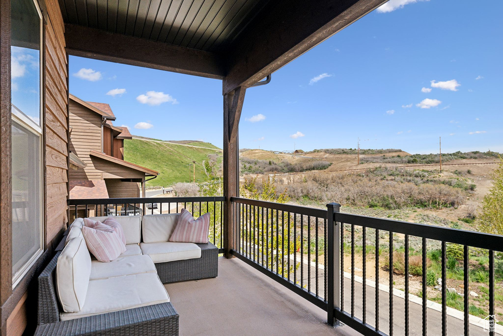 Balcony with an outdoor hangout area and a mountain view