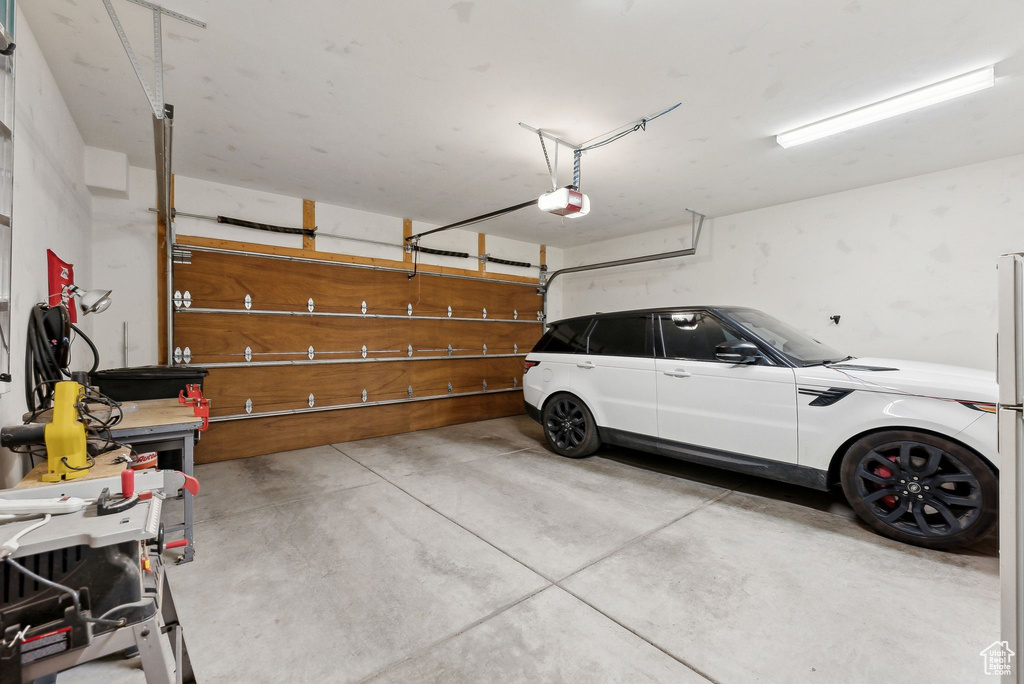 Garage featuring a garage door opener