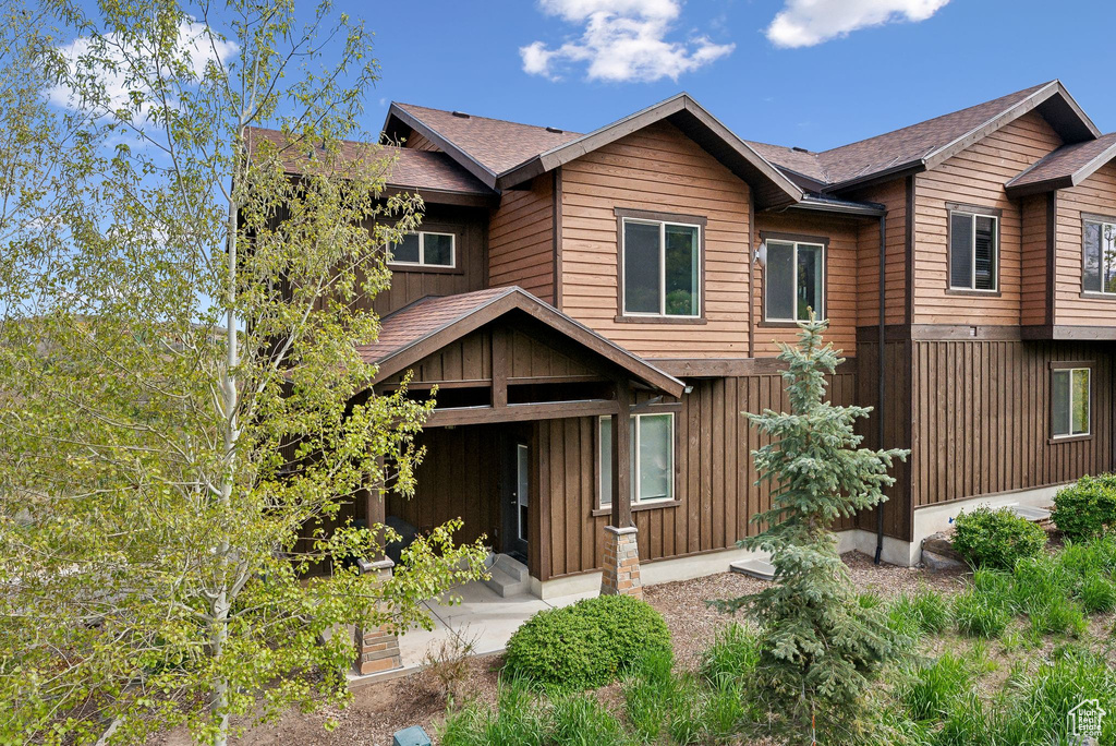 Rustic home with a shingled roof