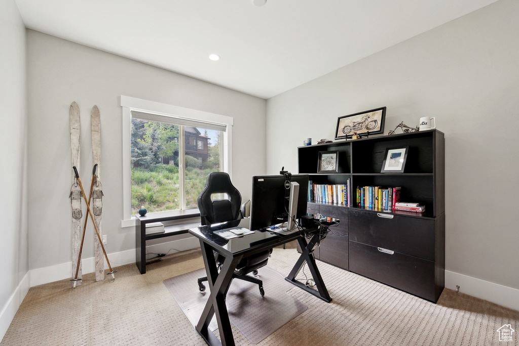 Office area featuring light carpet, baseboards, and recessed lighting