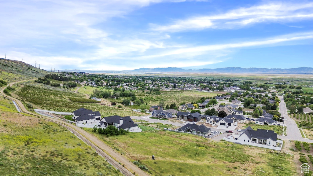 Aerial view of residential area featuring a mountainous background