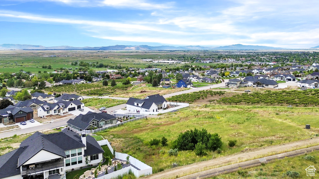 Aerial view of residential area featuring a mountainous background