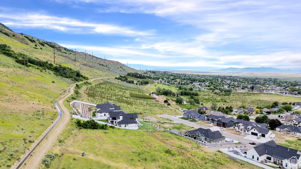 Aerial perspective of suburban area with a mountainous background