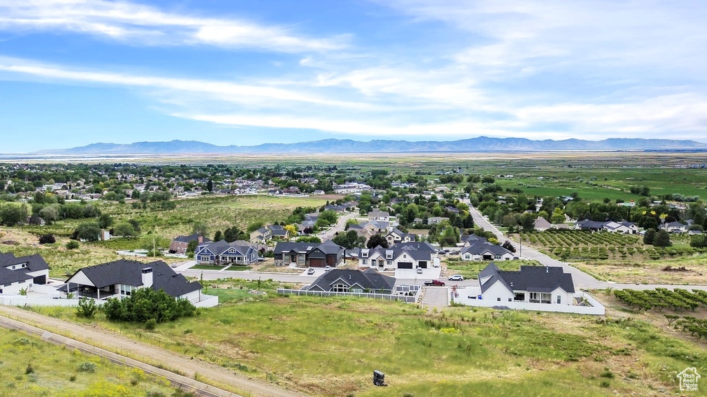 Aerial perspective of suburban area featuring a mountain backdrop