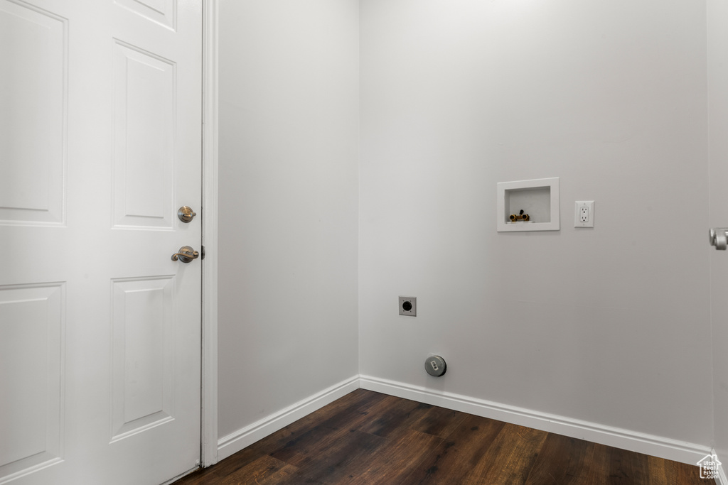 Laundry room with electric dryer hookup, dark wood-style floors, baseboards, and hookup for a washing machine