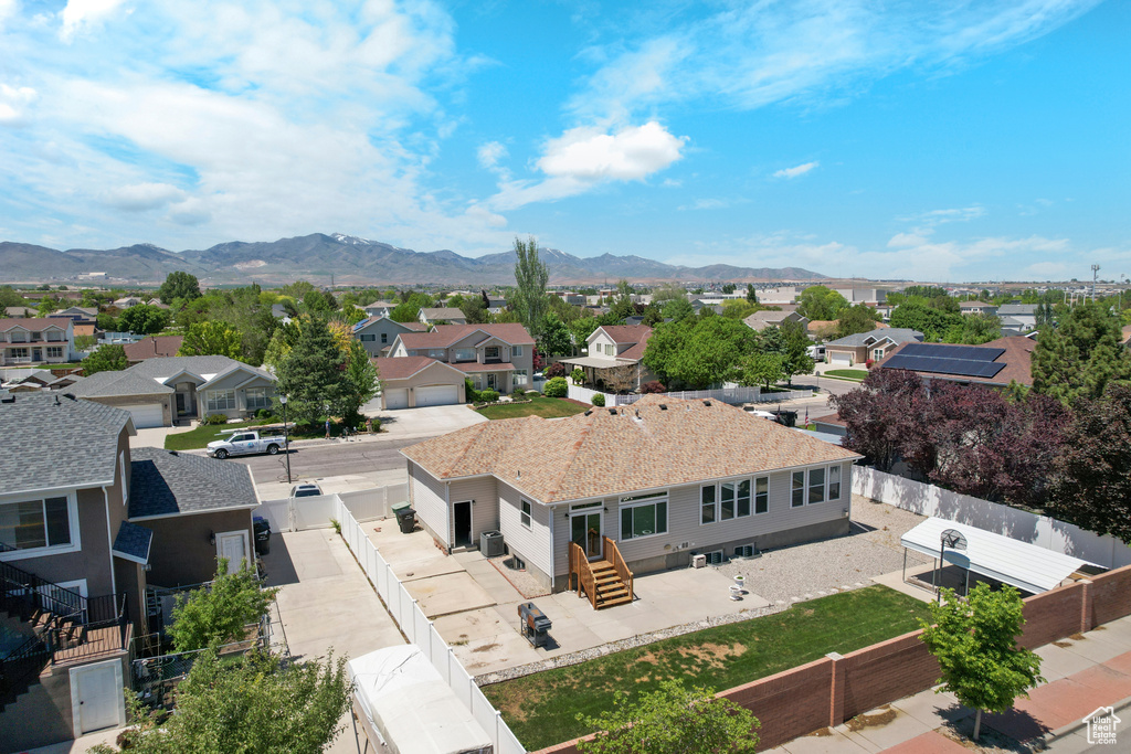 Aerial perspective of suburban area with a mountainous background