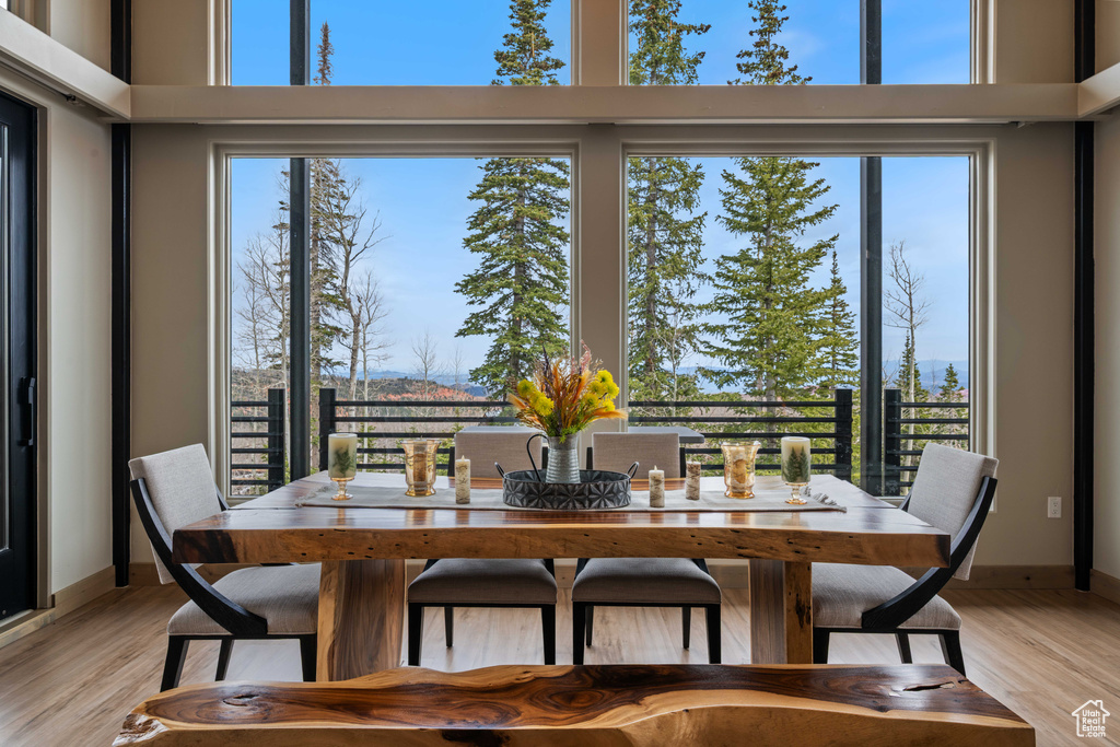 Dining room with light wood-style flooring and baseboards