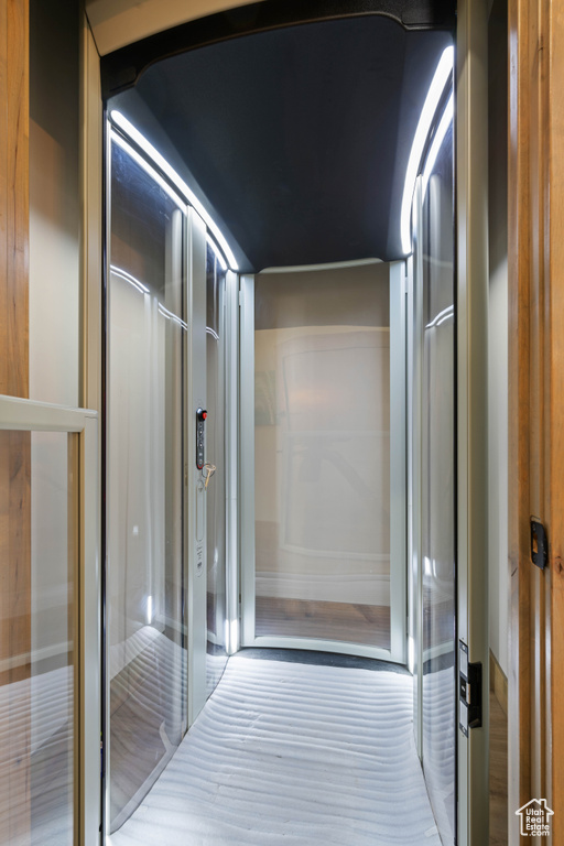 Corridor featuring elevator