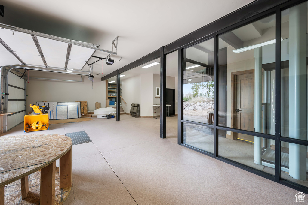 Garage featuring a garage door opener