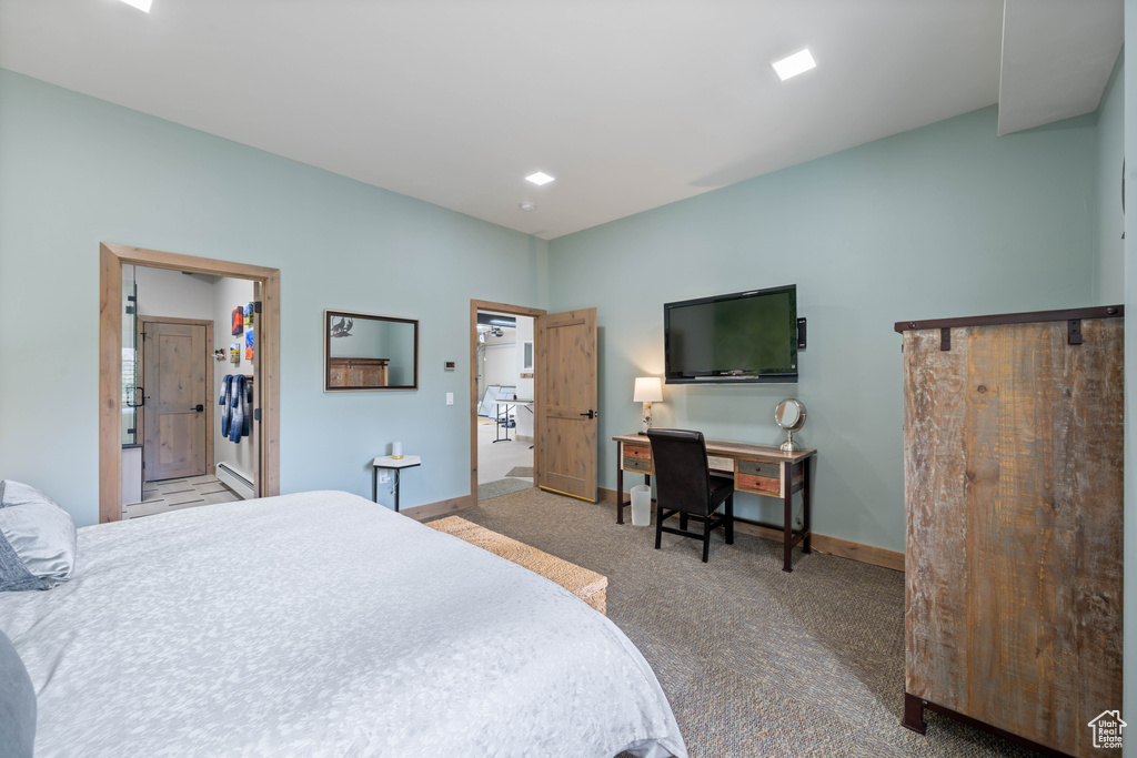 Bedroom with carpet floors and baseboards