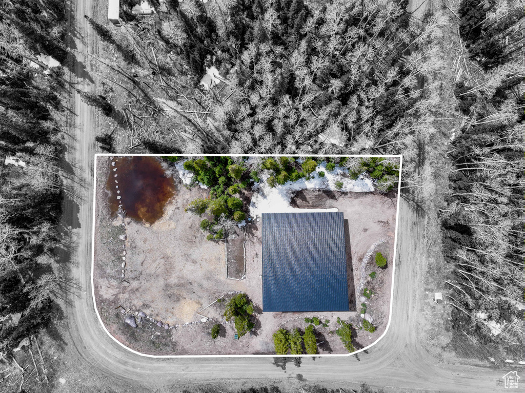 Aerial view of property and surrounding area with property boundaries highlighted