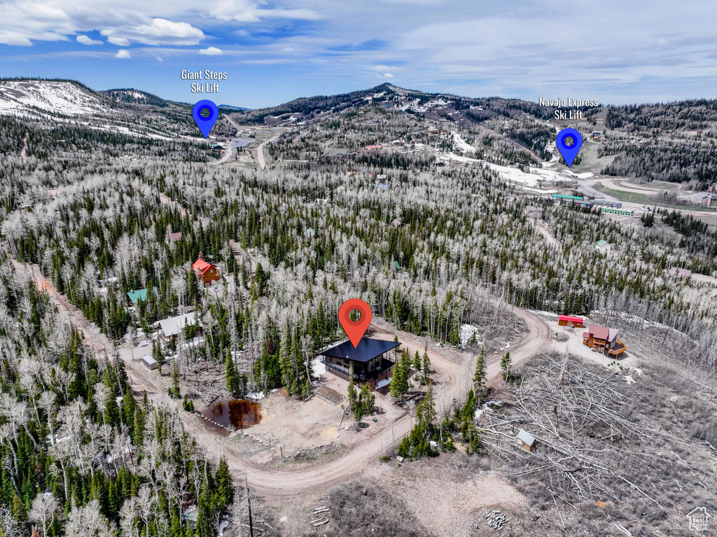 Snowy aerial view featuring a mountain view