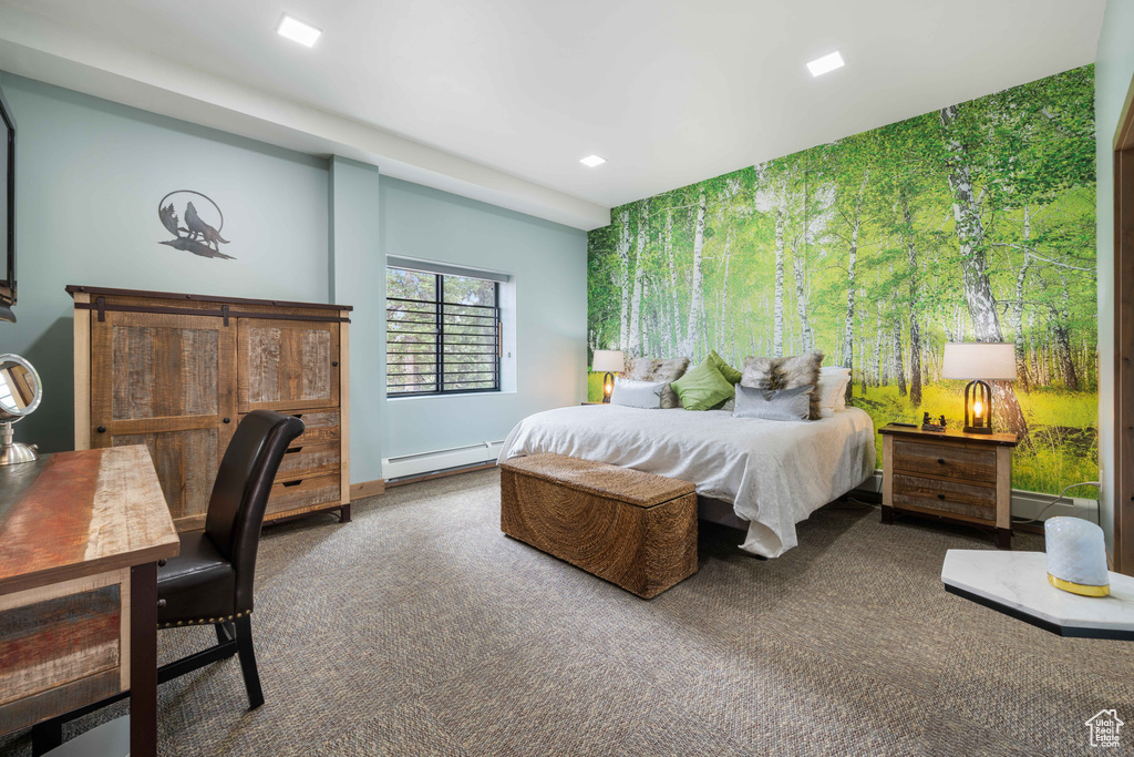 Carpeted bedroom featuring baseboard heating and recessed lighting