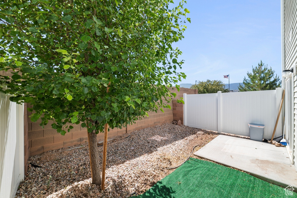 Fenced backyard featuring a patio area
