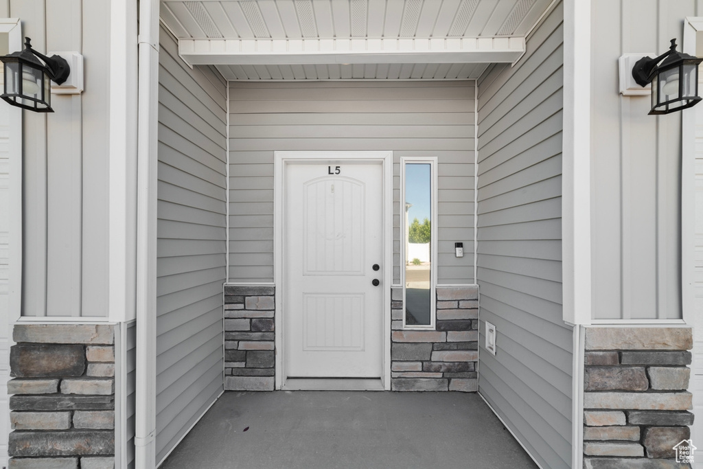 Property entrance with stone siding