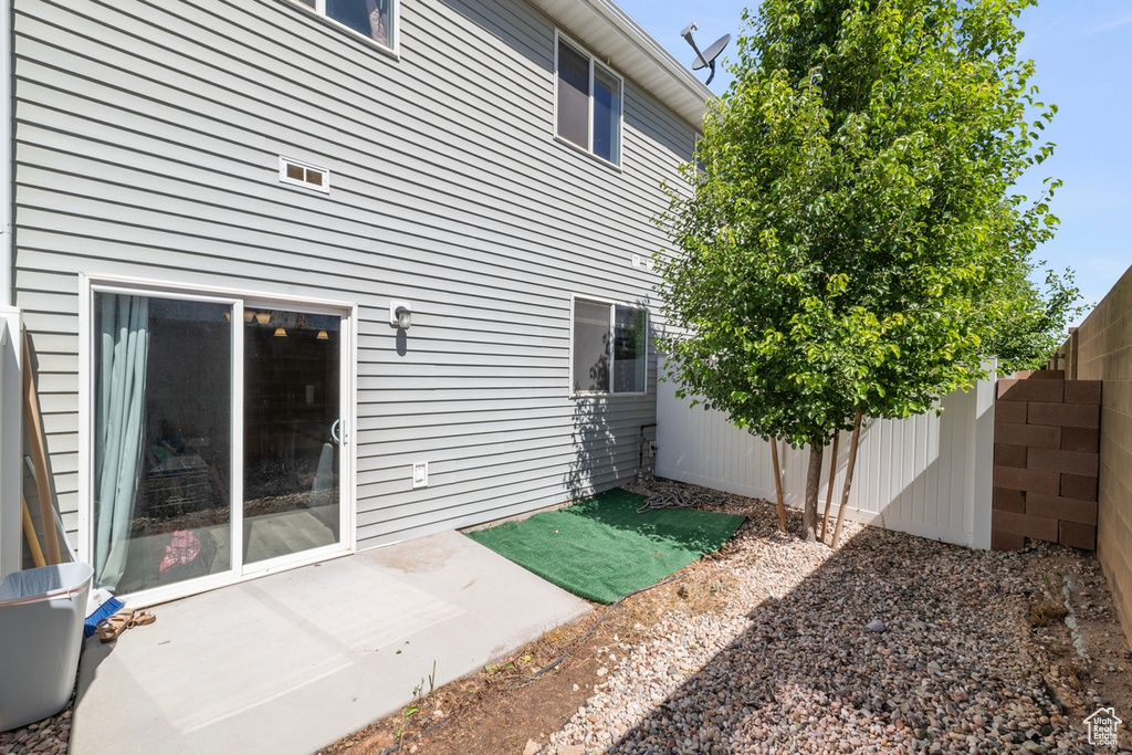 Rear view of property with a patio