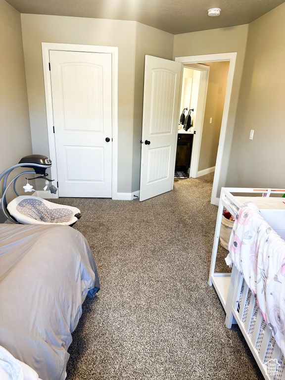 Carpeted bedroom with baseboards