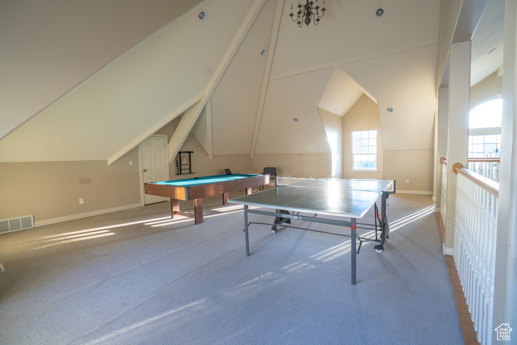 Rec room featuring carpet flooring, baseboards, lofted ceiling, and billiards table