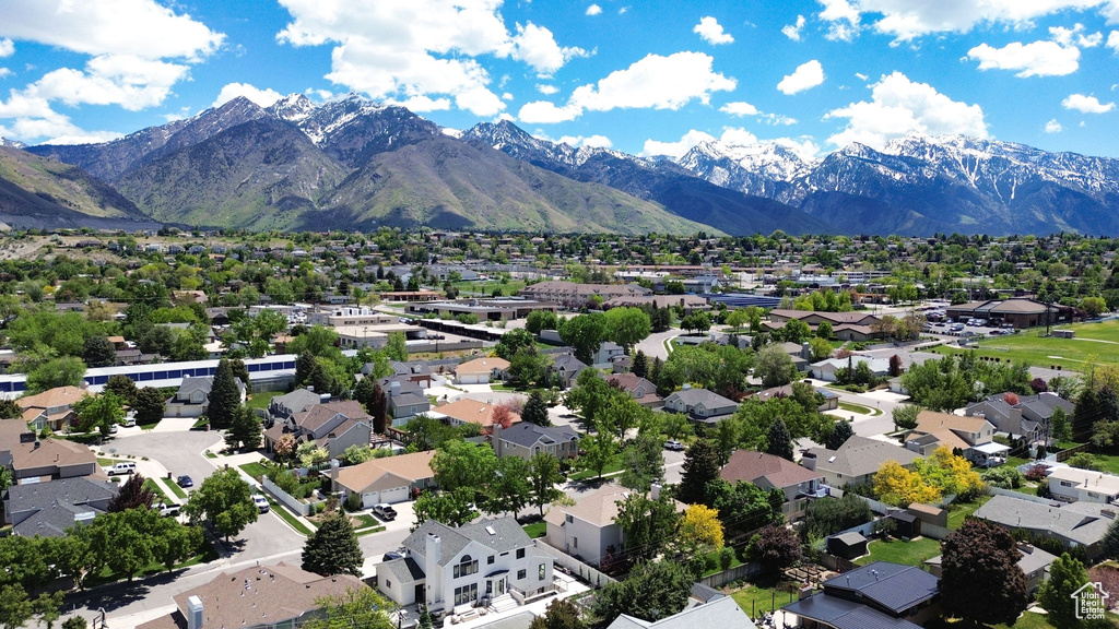 Aerial view of residential area featuring mountains