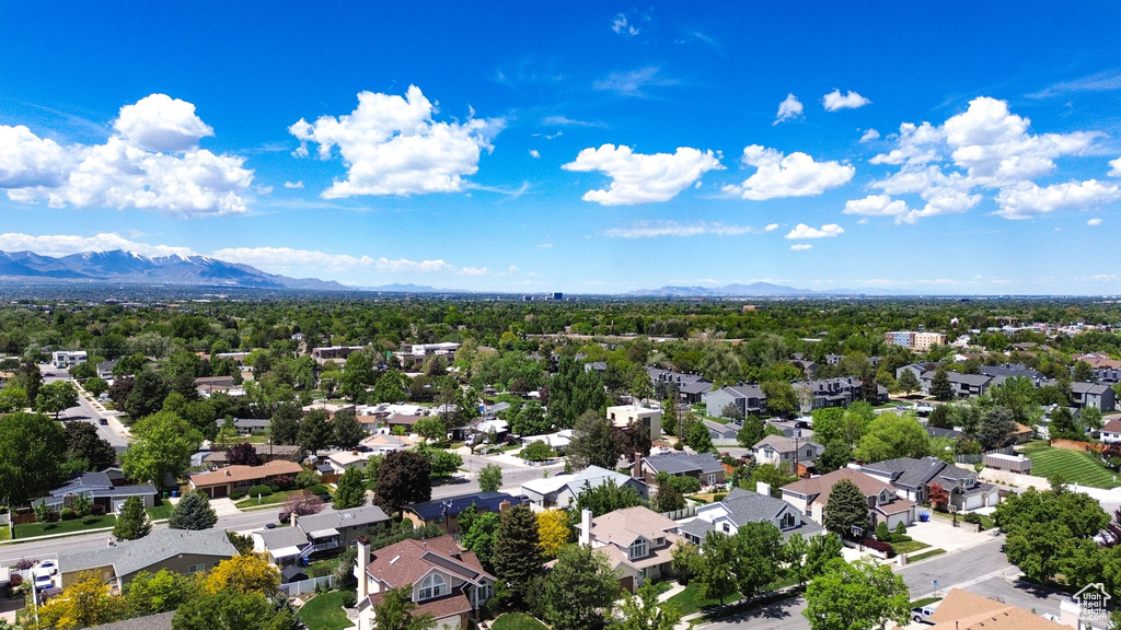 Aerial perspective of suburban area featuring a mountain backdrop