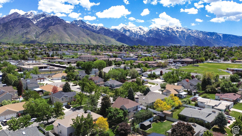 Aerial perspective of suburban area featuring a mountainous background
