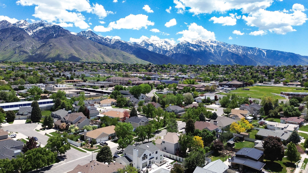 Aerial view of residential area featuring mountains