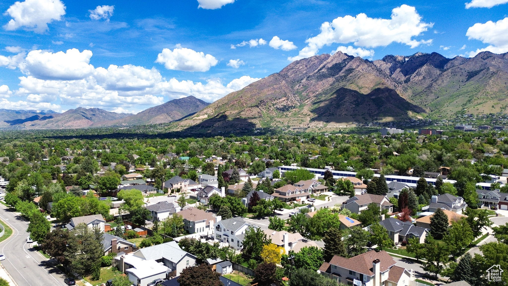 Aerial perspective of suburban area with a mountain backdrop