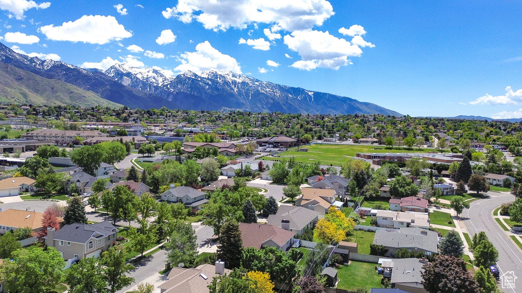 Aerial view of residential area with a mountain backdrop