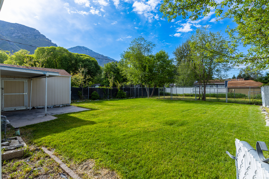 View of yard featuring a mountain view and a patio area