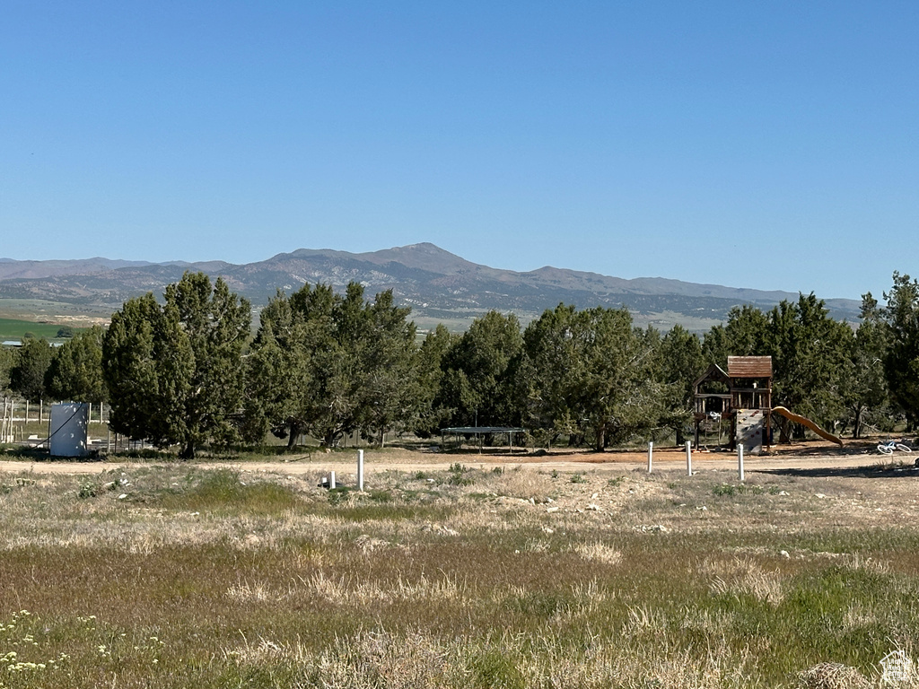 View of mountain background featuring rural landscape