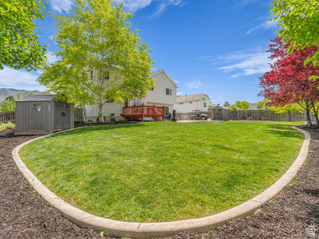 View of yard featuring a wooden deck