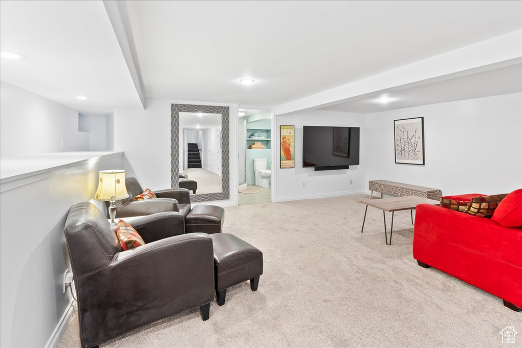 Living room featuring carpet, recessed lighting, and baseboards