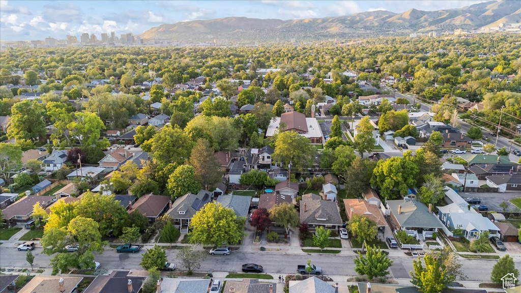 Aerial perspective of suburban area with a mountain backdrop