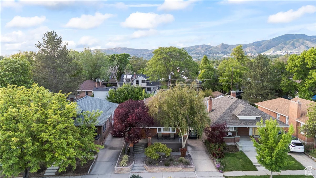 View of subject property with a mountain backdrop