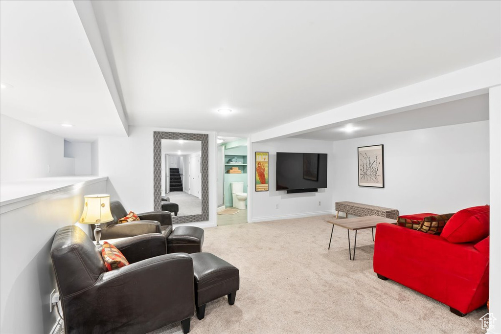 Living room featuring carpet, recessed lighting, and baseboards