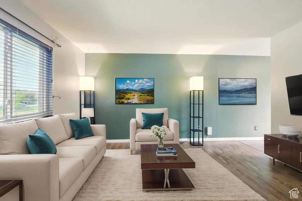 Living area featuring wood finished floors and baseboards