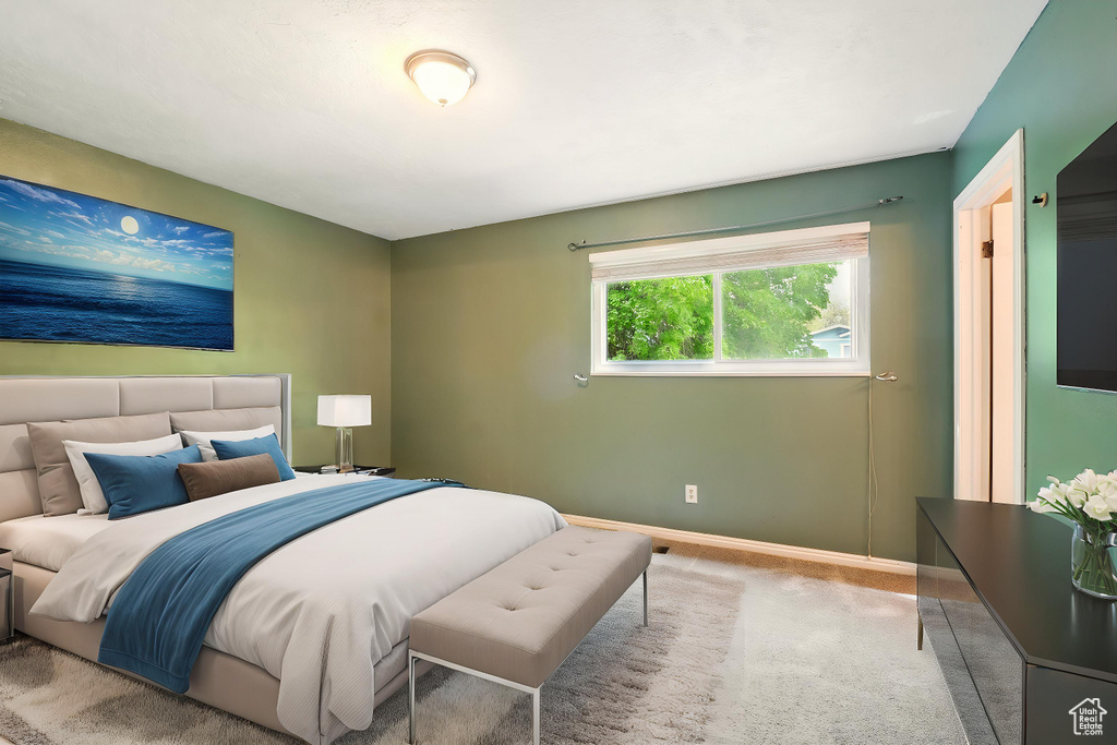 Bedroom with carpet and baseboards
