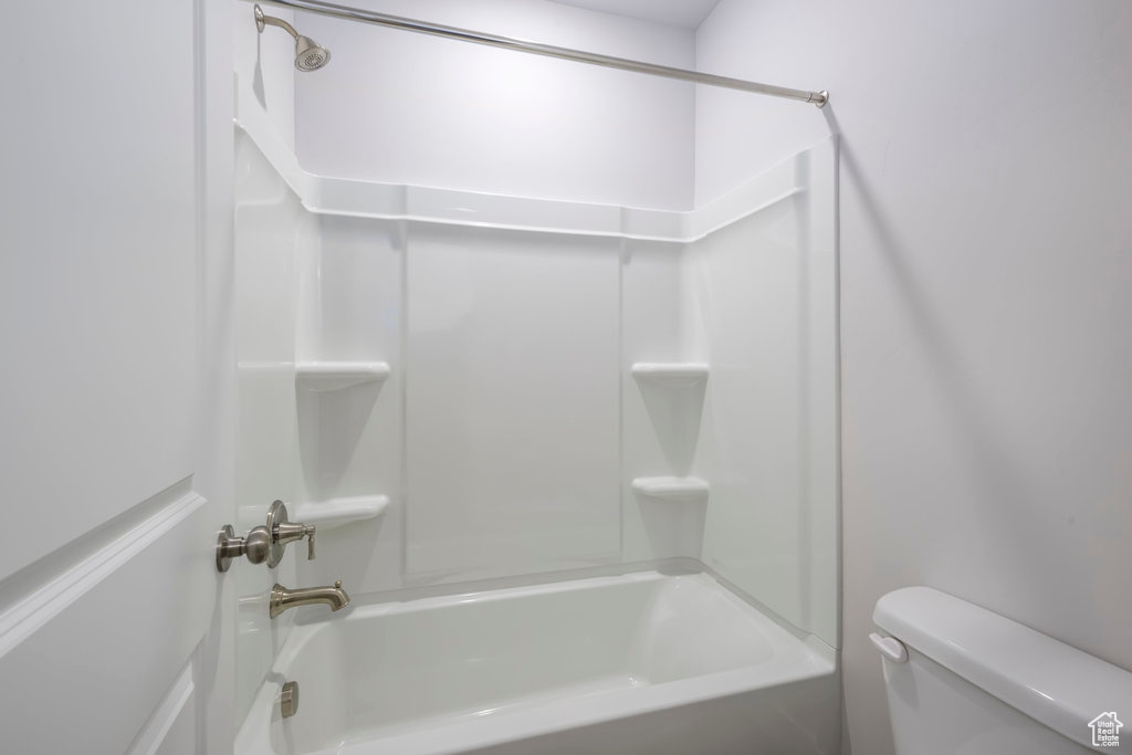 Bathroom with toilet and shower / tub combination