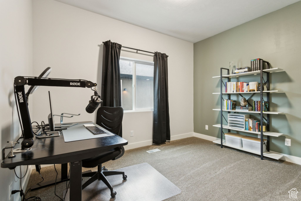 Carpeted office with baseboards