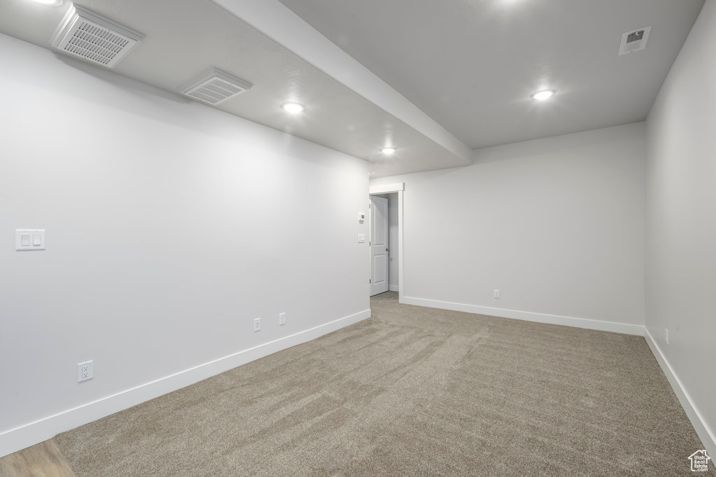 Unfurnished room featuring baseboards, recessed lighting, and carpet floors